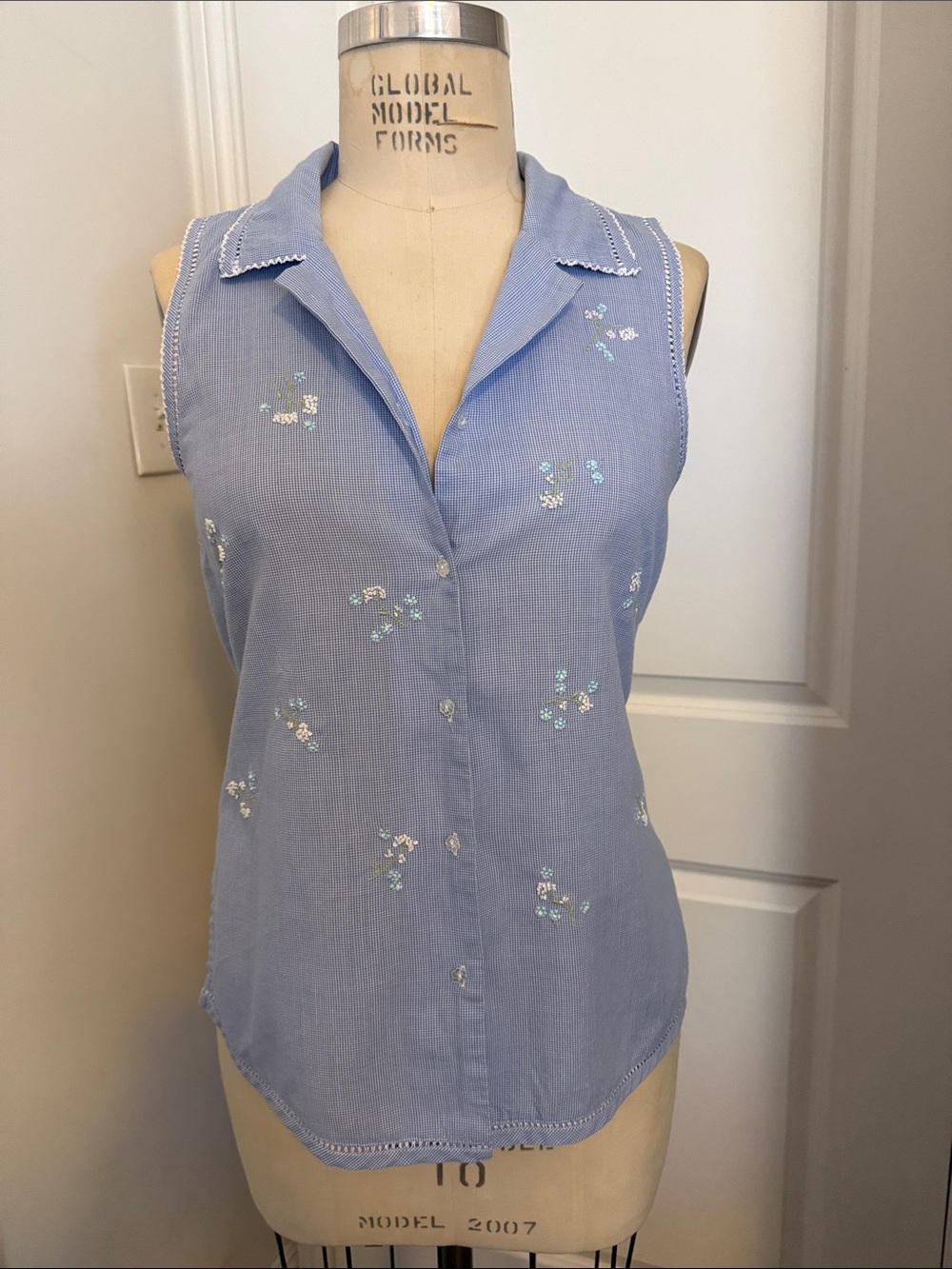 Aria Sky Blue Sleeveless Button-Up Blouse with Delicate Floral Embroidery